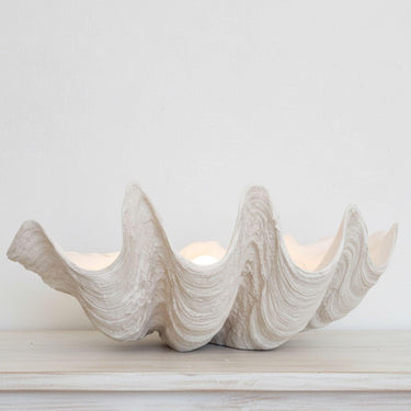 Oversized clam shell bowl styled as a standalone minimalist centerpiece