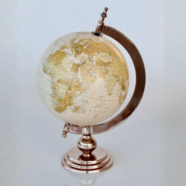 Side view of Large World Globe showing brass stand detail on a desk