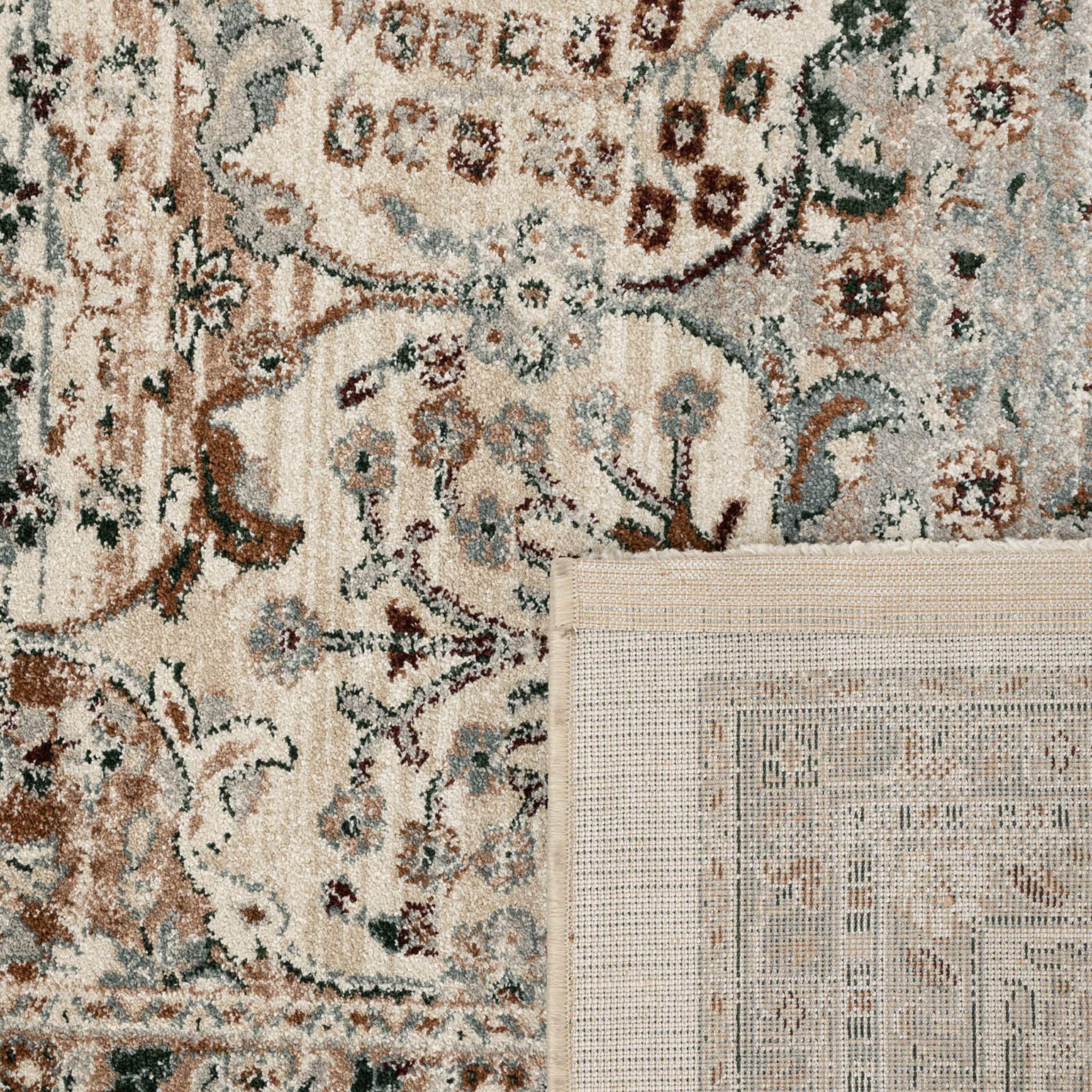 Close-up of Ledger Rug in Tarnish showing the desaturated Persian pattern and weave
