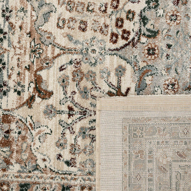 Close-up of Ledger Rug in Tarnish showing the desaturated Persian pattern and weave