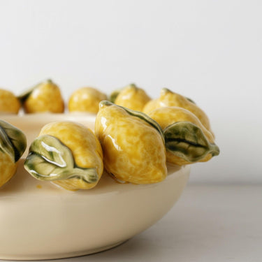 sculpted lemons with green leaves detailing on the lemon ceramic bowl