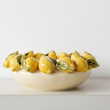 Decorative bowl with ceramic lemons 