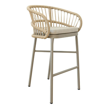 Lola modern bar stool featuring a light beige curved backrest and armrests made of natural woven rattan,  seat cushion, and a slim beige metal frame.