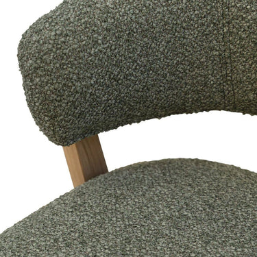 Polyester textured green fabric on counter stool.