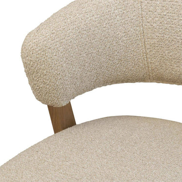 Polyester textured ivory fabric on counter stool.
