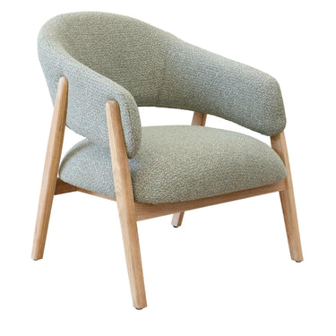 Modern armchair with green fabric and wooden legs.