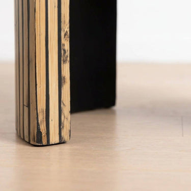 Close-up of curved slab-style legs