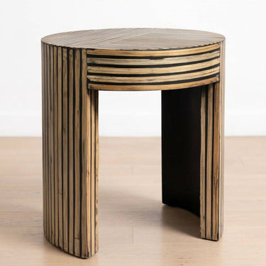 Round striped bamboo inlay accent table with black borders and curved slab legs.