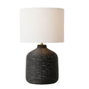 Black Rattan Modern Lamp witha a black rattan lamp base and neutral drum shade
