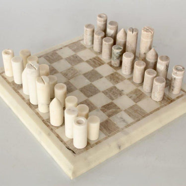 Shop the Marble Chess Set at Woodka Interiors, featuring elegant marble pieces that blend entertainment and sophistication, perfect for home or office decor.