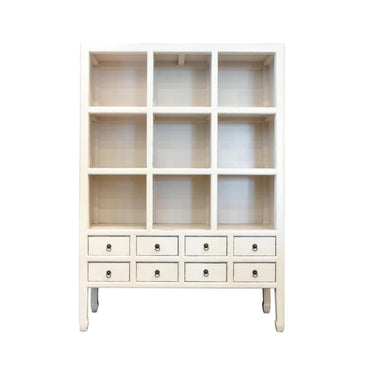 A tall, white-painted Chinese Mandarin-style display cabinet featuring nine open square cubby shelves above eight small uniform drawers with brass ring pulls.