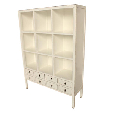 White display bookshelf with multiple cubby shelves and eight drawers by Woodka Interiors 