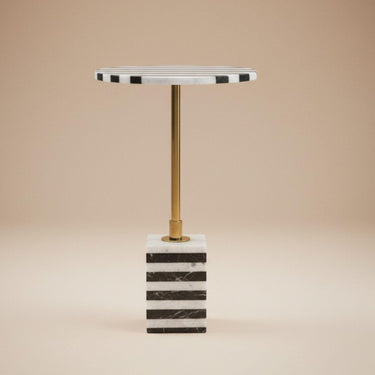 Black and white striped marble side table with brass stem