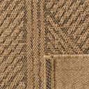 Textured detail of Marcus outdoor rug showing the modern herringbone-style weave and subtle black lines.