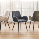 margot dining chairs in different colors arranged in a row with sheer curtains in the background.