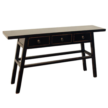 Detailed angled view of the black solid elmwood console table highlighting its modern organic luxury and lived-in finish