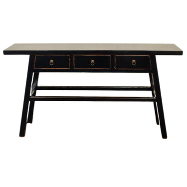 Black Maya console table with a sleek silhouette and three drawers accented by traditional brass ring pulls