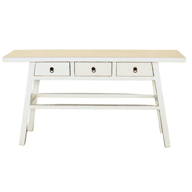 White Maya console table featuring a distressed finish and three functional drawers with brass ring pulls