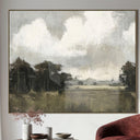 Meadowlore wall art in framed abstract landscape painting on a wall above a  armchair.