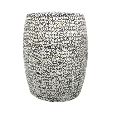 Monaco ceramic side table featuring a bold black and white pattern.