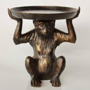 monkey holding round tray on head