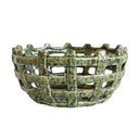 A ceramic basketweave bowl with a textured, speckled green glaze.