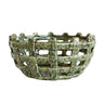 A ceramic basketweave bowl with a textured, speckled green glaze.