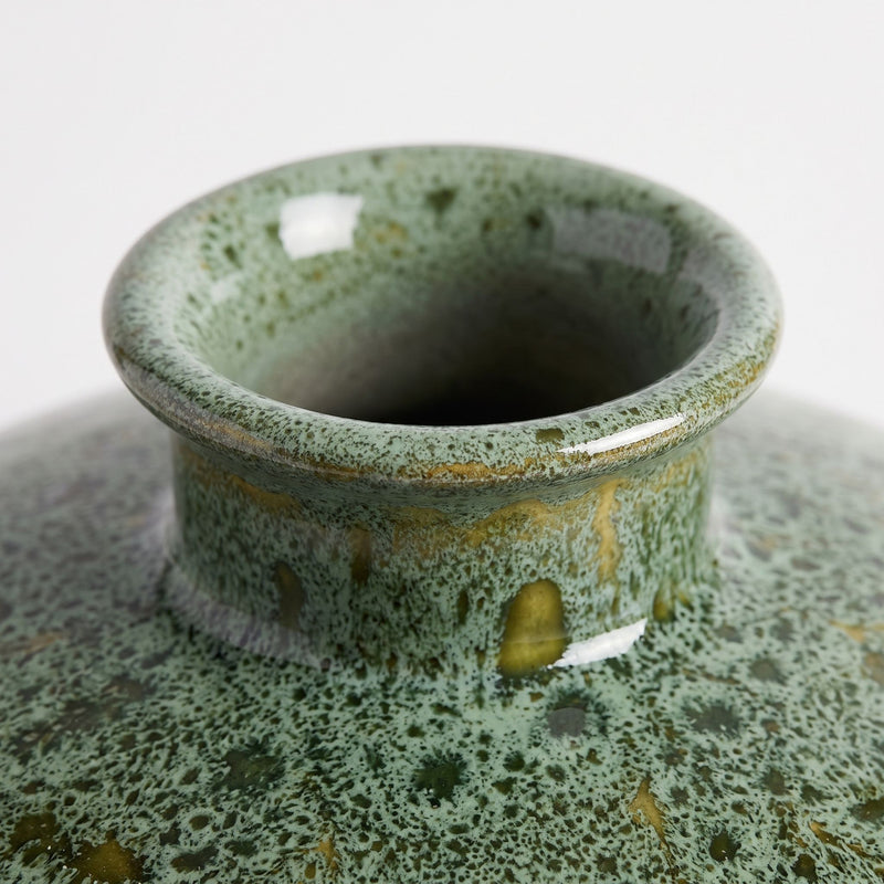 Mottled green ceramic vase with a wide round shape and short flared neck, glazed in layered shades of green