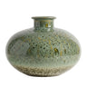 Mottled green ceramic vase with a wide round shape and short flared neck, glazed in layered shades of green