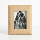 Front view of the Sana rectangular photo frame with a wide textured beige raffia border and mitered corners.