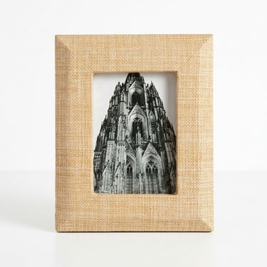 Front view of the Sana rectangular photo frame with a wide textured beige raffia border and mitered corners.