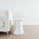 White Nova Side Table styled as a modern round ceramic side table in living room