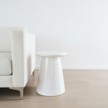 White Nova Side Table styled as a modern round ceramic side table in living room