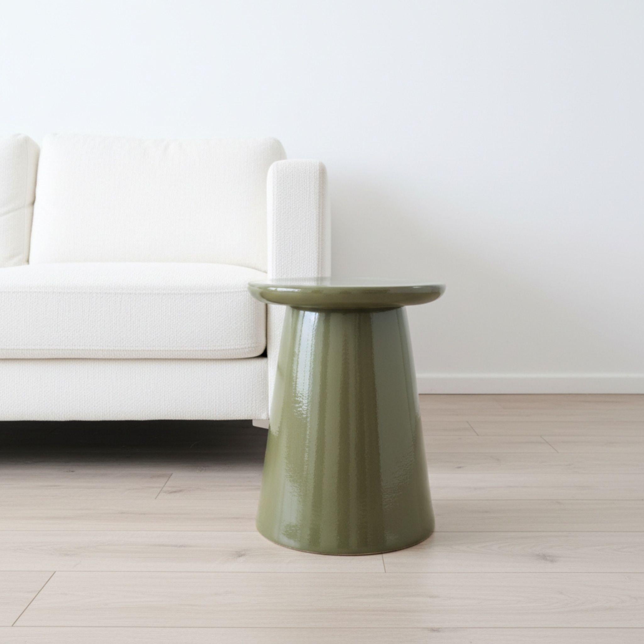 Olive Green Nova Side Table styled in a minimalist modern living room