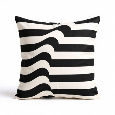A square scatter cushion with a black and white graphic pattern featuring horizontal stripes that warp into fluid waves down the center.