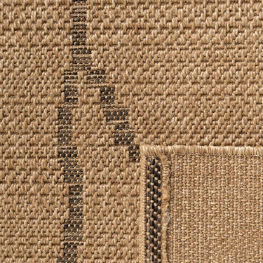 Close-up texture of Palau tribal geometric rug featuring black line accents on a neutral wicker background.