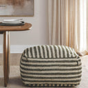 paralla square striped ottoman in neutral beige and charcoal  in a dining room.