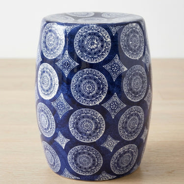 Porto blue and white ceramic stool with intricate medallion pattern.