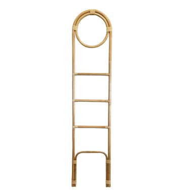 Natural rattan loop towel ladder as a freestanding bathroom towel rail holding towels and blankets.