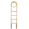 Natural rattan loop towel ladder as a freestanding bathroom towel rail holding towels and blankets.