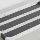 Close-up of rectangle marble tray showing black and white veining