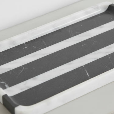 Close-up of rectangle marble tray showing black and white veining