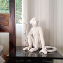 Sitting resin monkey table lamp on bedroom nightstand