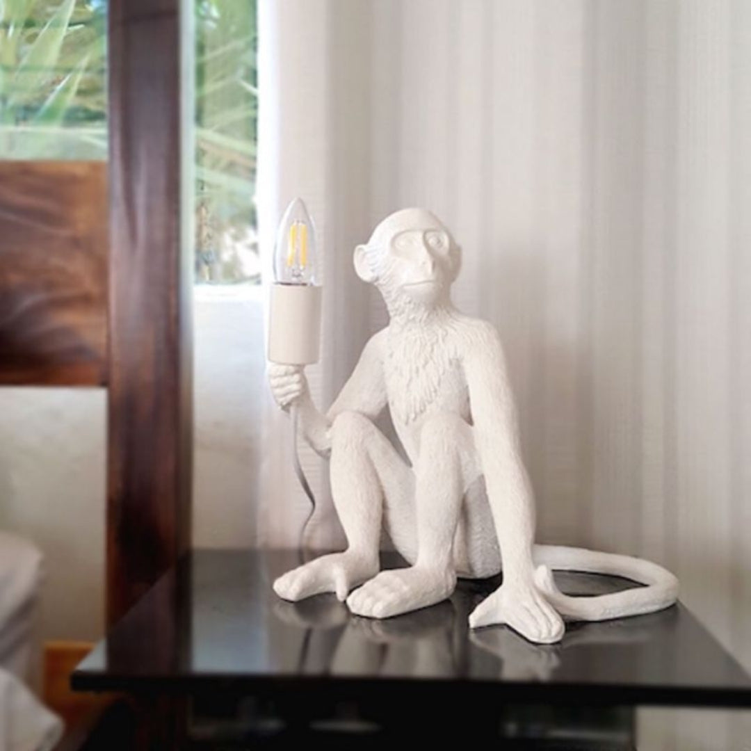 Sitting resin monkey table lamp on bedroom nightstand