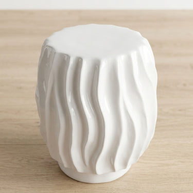 Ripple side table top with wavy ridged texture base in glossy white ceramic.