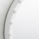 Close-up of beaded detail on round wall mirror