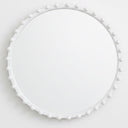 White round mirror with beads styled on wall