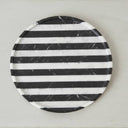 Round black marble tray shown from above with horizontal stripes