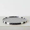Round black marble vanity tray in black and white striped marble