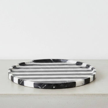 Round black marble vanity tray in black and white striped marble